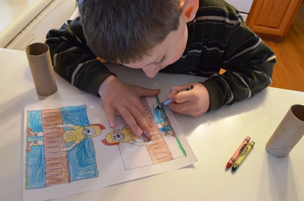 Boy coloring Easter coloring sheet