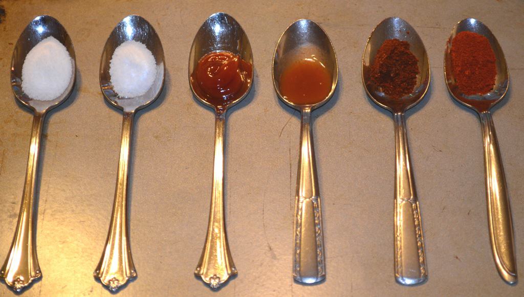 6 spoons, one of each with: salt, baking soda, ketchup, tobasco, chili powder, and paprika