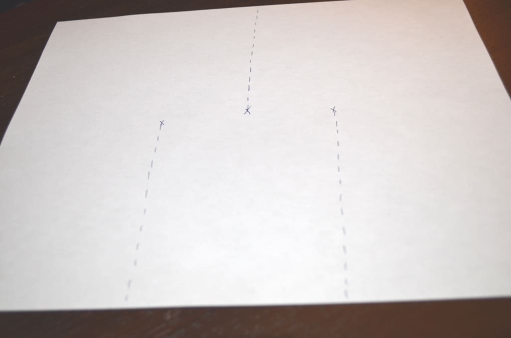 sheet of typing paper with 3 dashed lines showing where to cut the paper