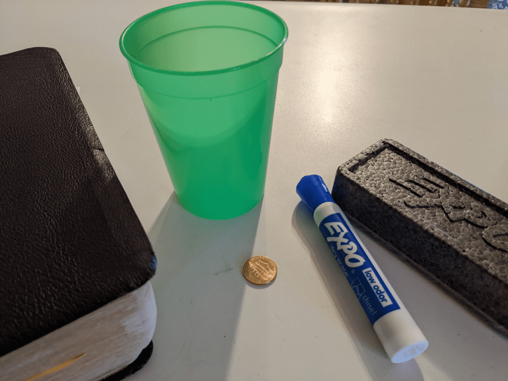 bible, cup, penny, marker, and eraser